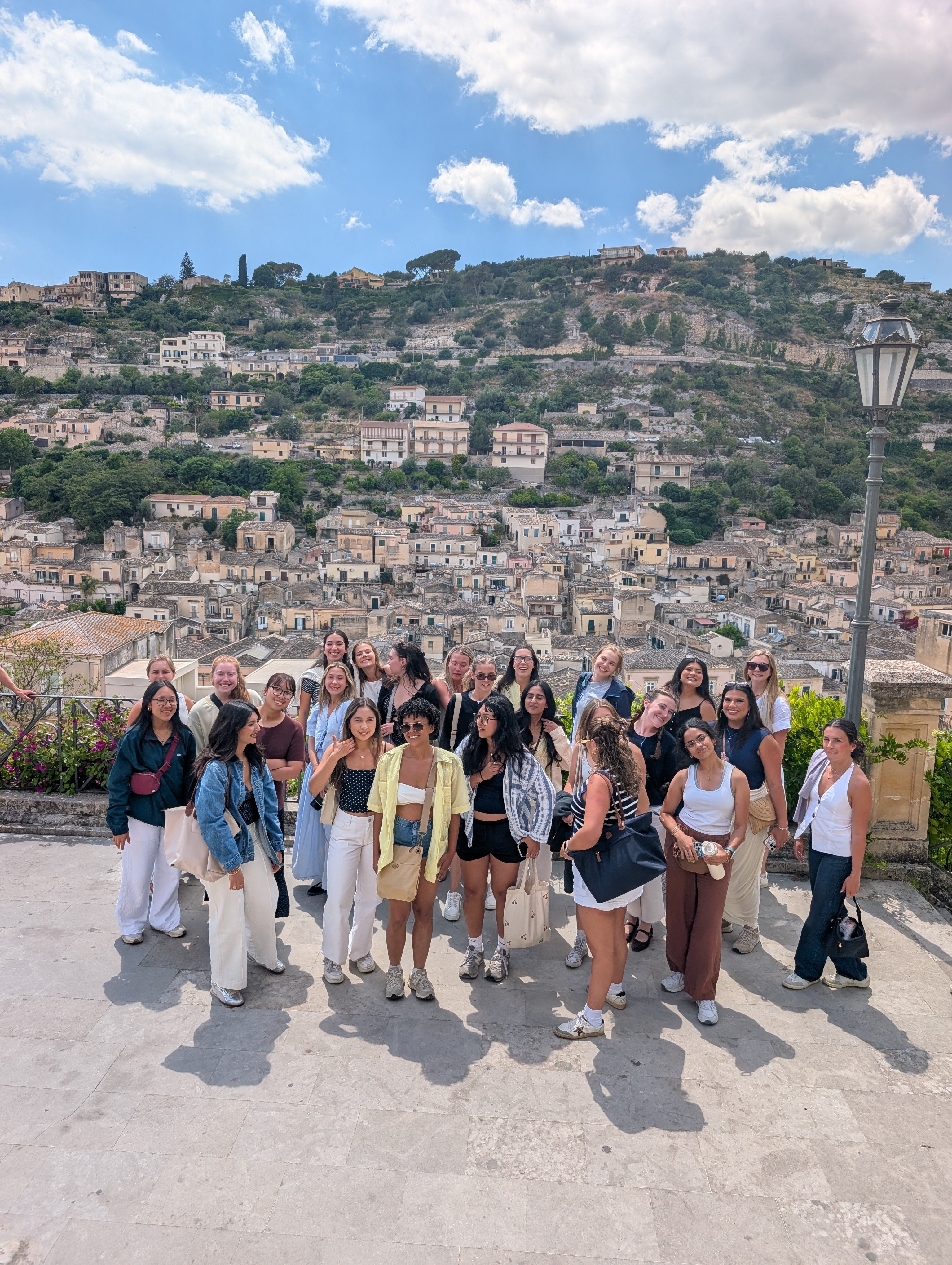 Students in front of a mountain in Italy